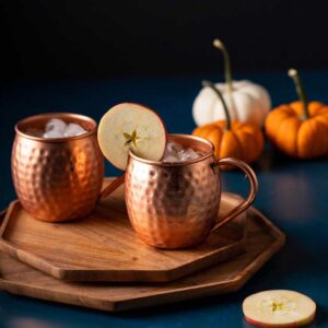 two copper mugs with kentucky mules