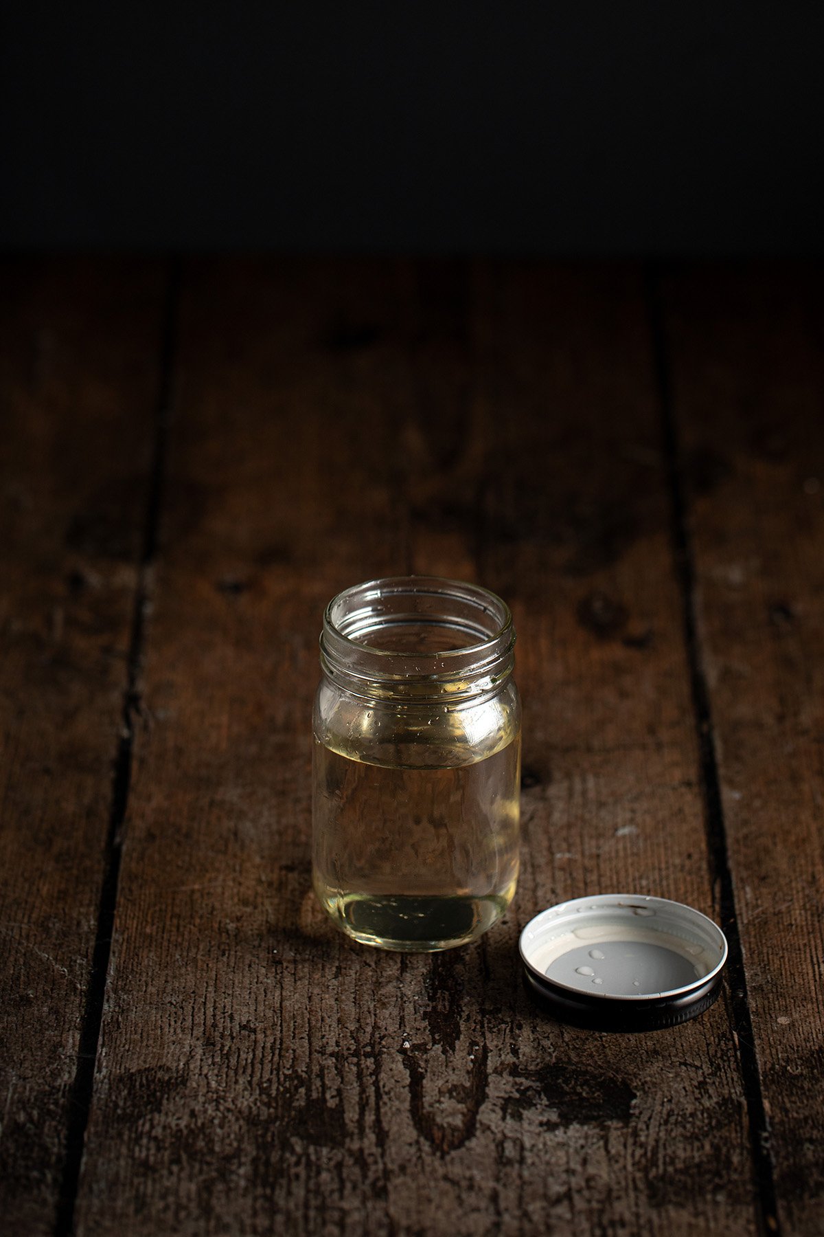 a small jar of simple syrup, the lid off