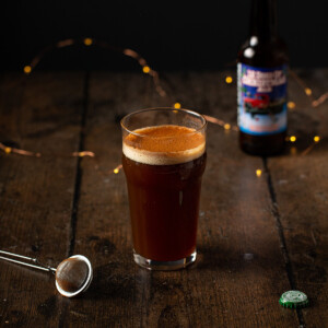 a loaded christmas ale on a wooden background.