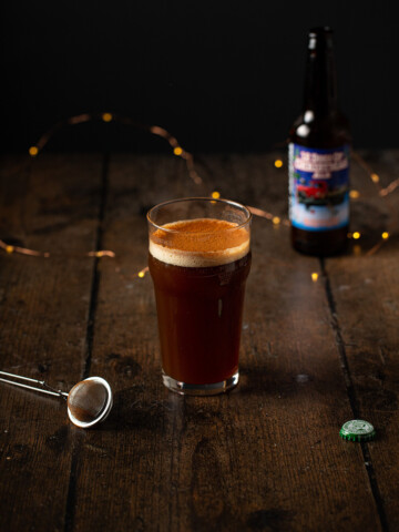 a loaded christmas ale on a wooden background