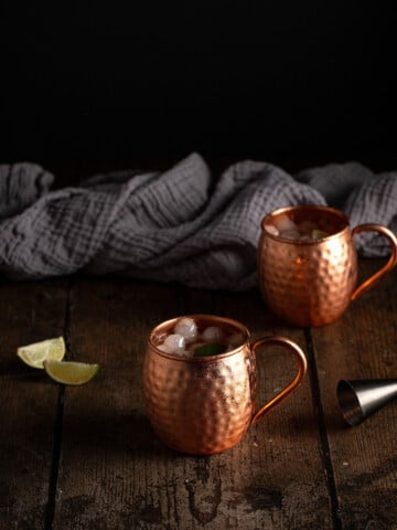 two copper mugs of moscow mules.