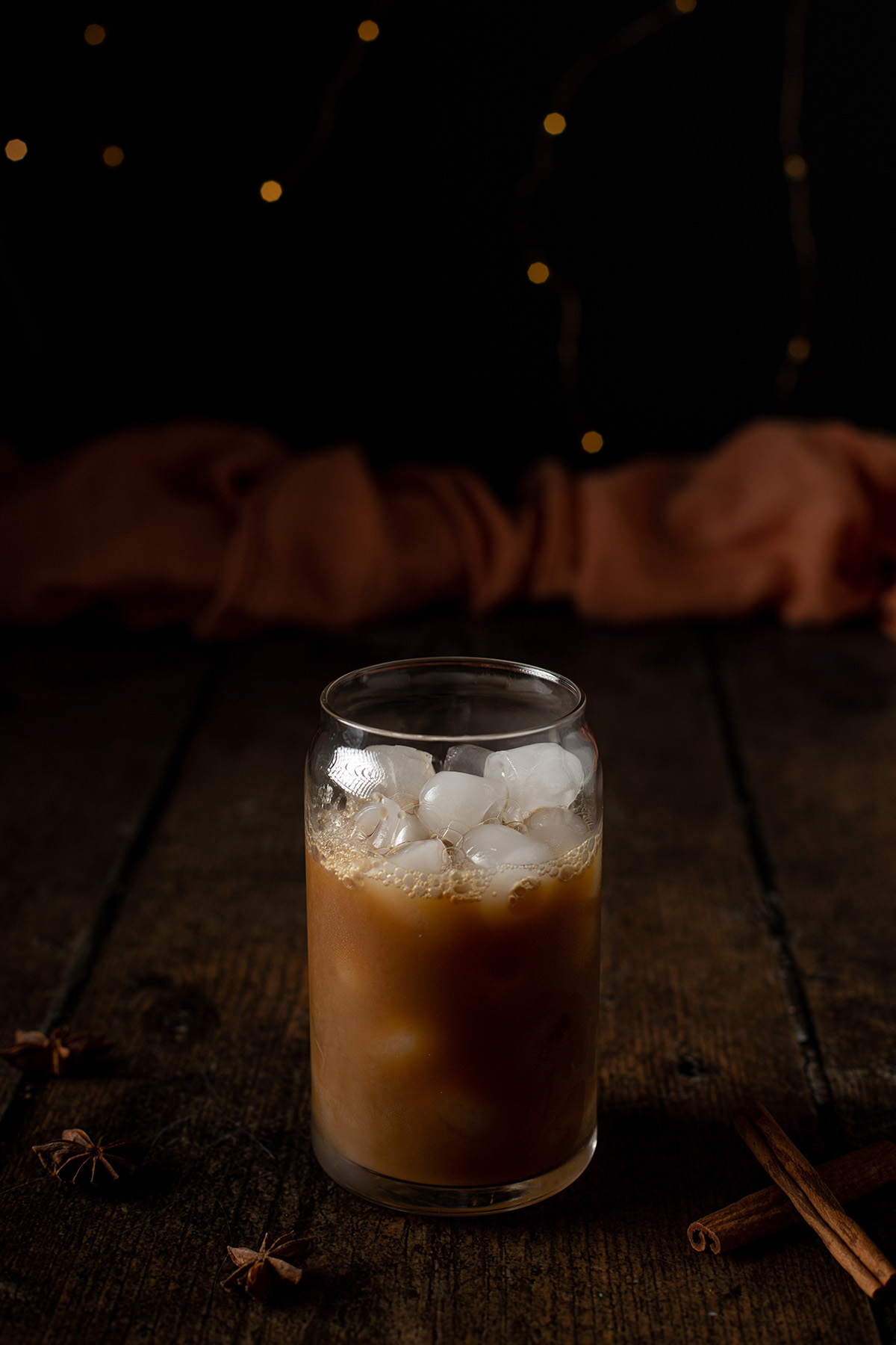 a glass that is ¾ full of chai concentrate.