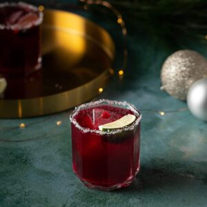 pomegranate margarita on a green background