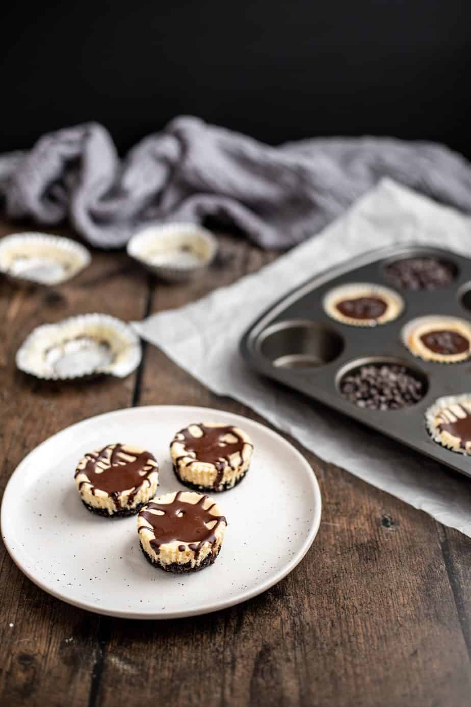 three mini cheesecakes on a plate