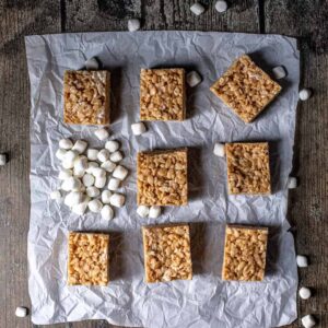overhead view of peanut butter rice krispie treats on a sheet of parchment paper