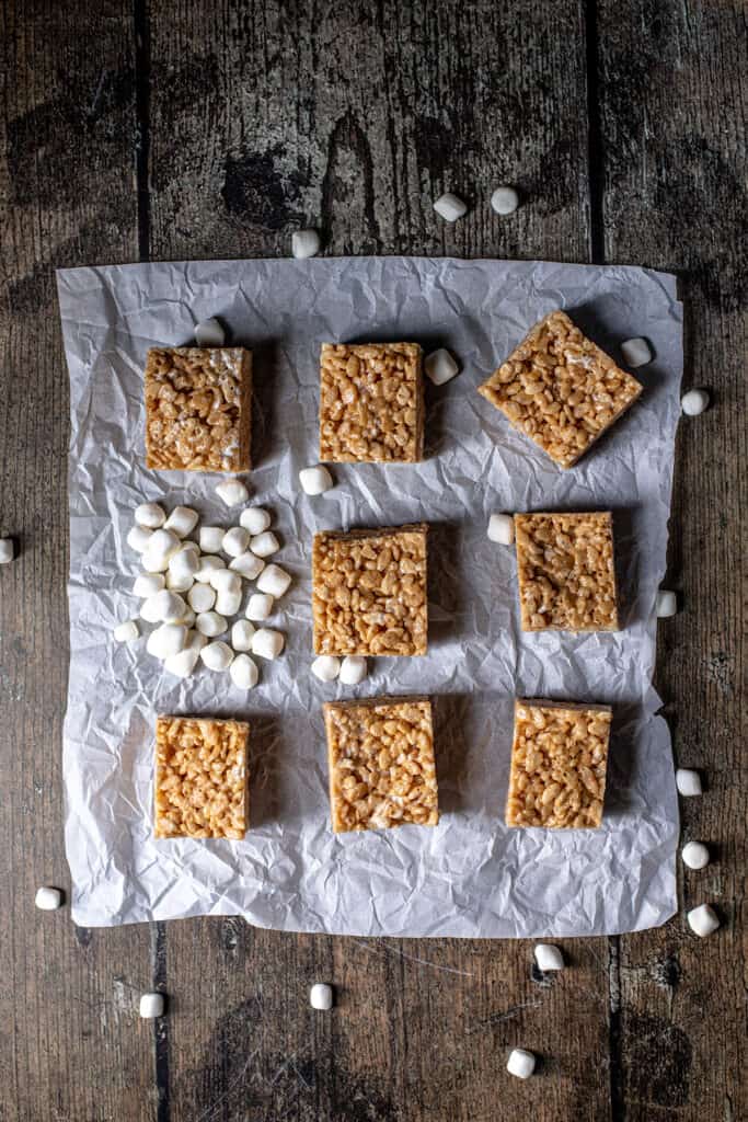 overhead view of peanut butter rice krispie treats on a sheet of parchment paper