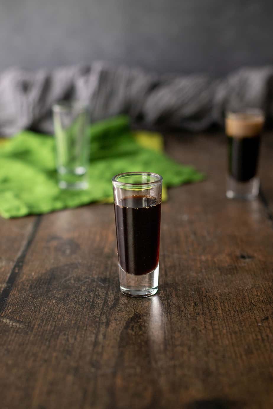 a shot glass with coffee liqueur.