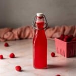 swing top bottle of raspberry simple syrup