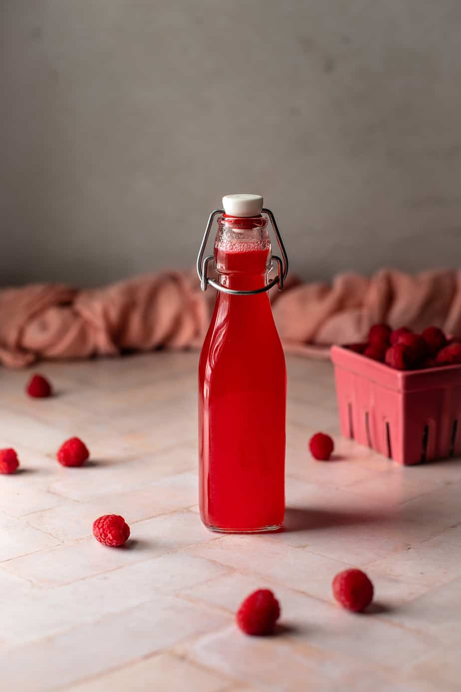 swing top bottle of raspberry simple syrup