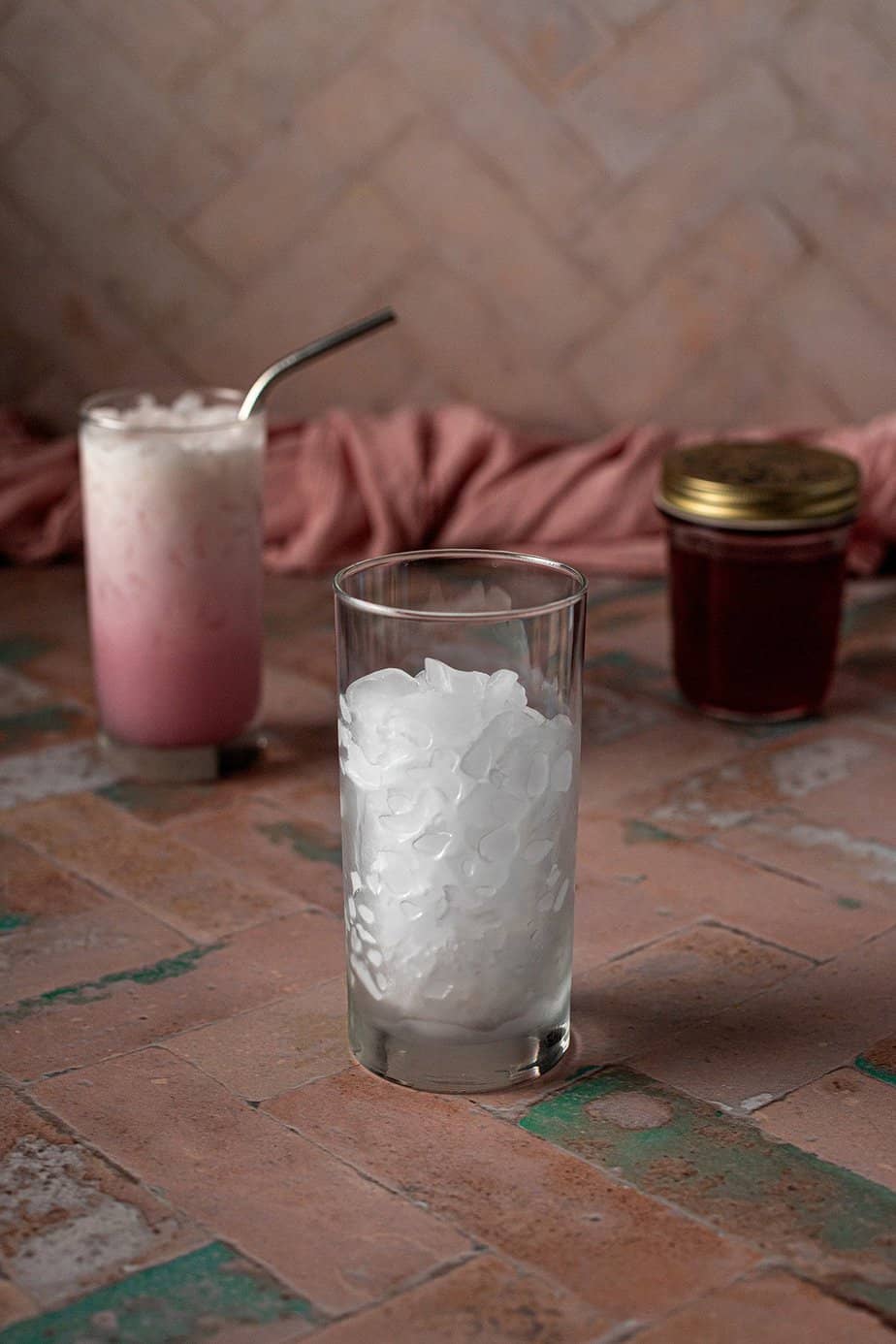 a tall glass with crushed ice