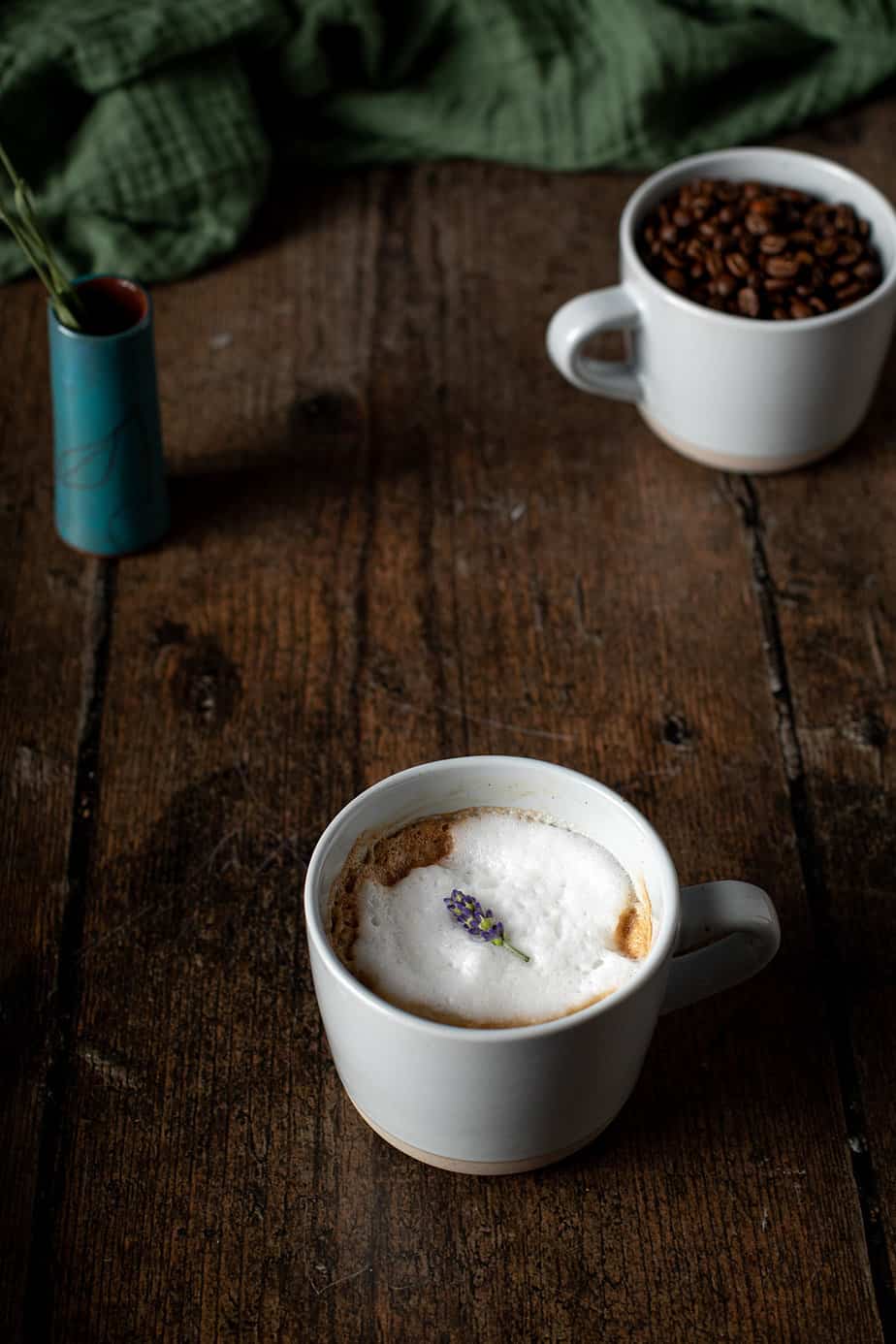 45 degree angle view of lavender latte in a mug