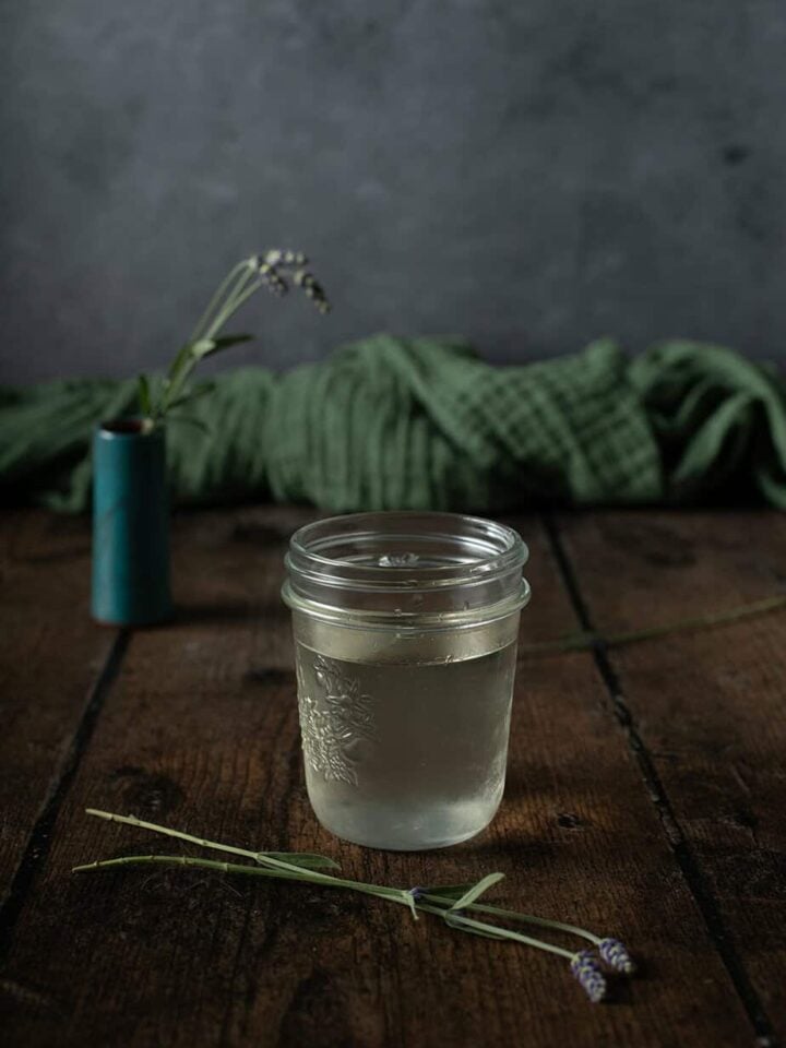 small jar filled with lavender simple syrup