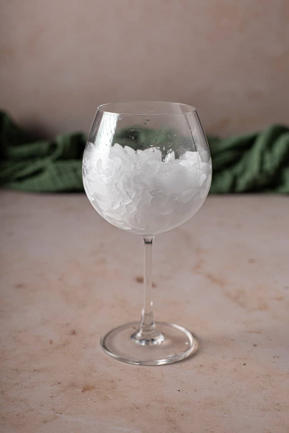 large wine glass filled with crushed ice