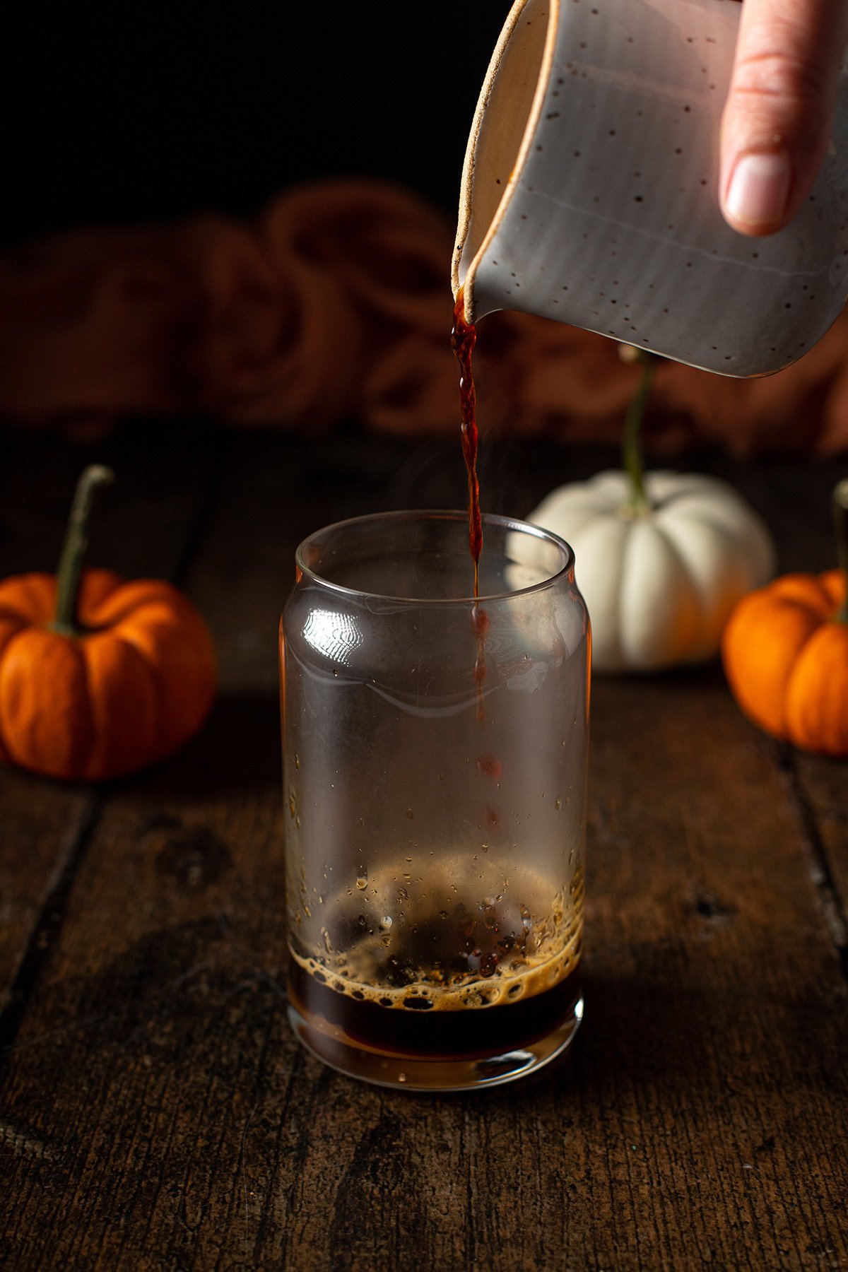 espresso being poured into a glass