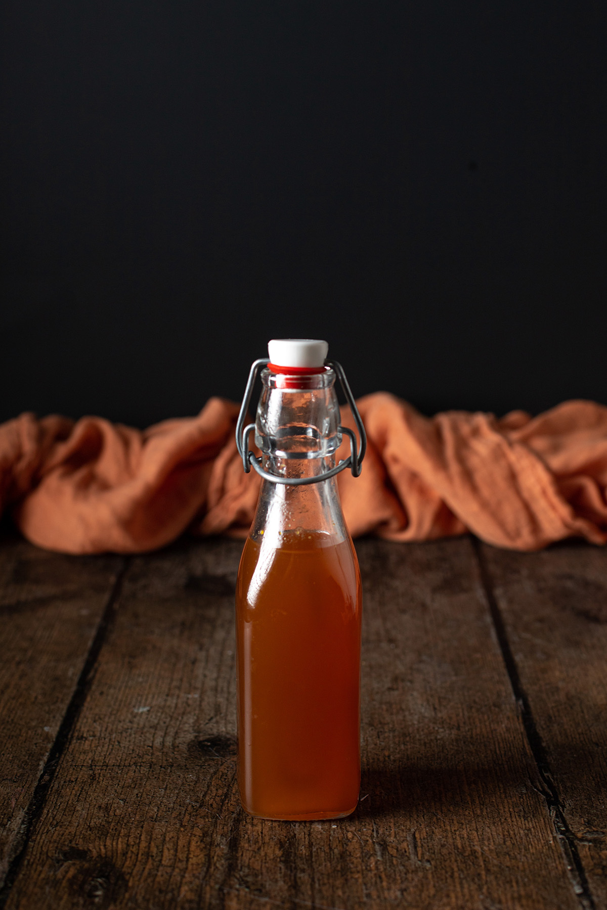 a small swing top bottle full of pumpkin spice syrup