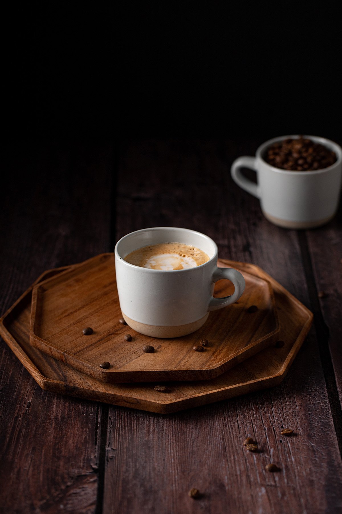 a mug full of blonde vanilla latte on a wooden tray