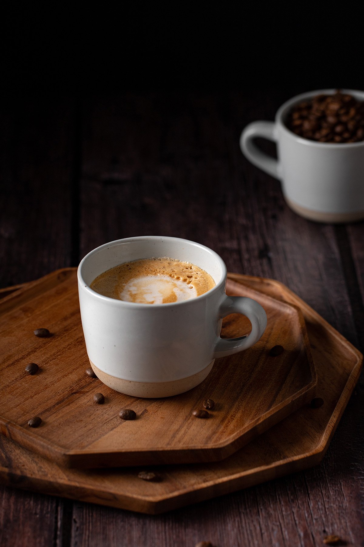 a mug full of blonde vanilla latte on a wooden tray