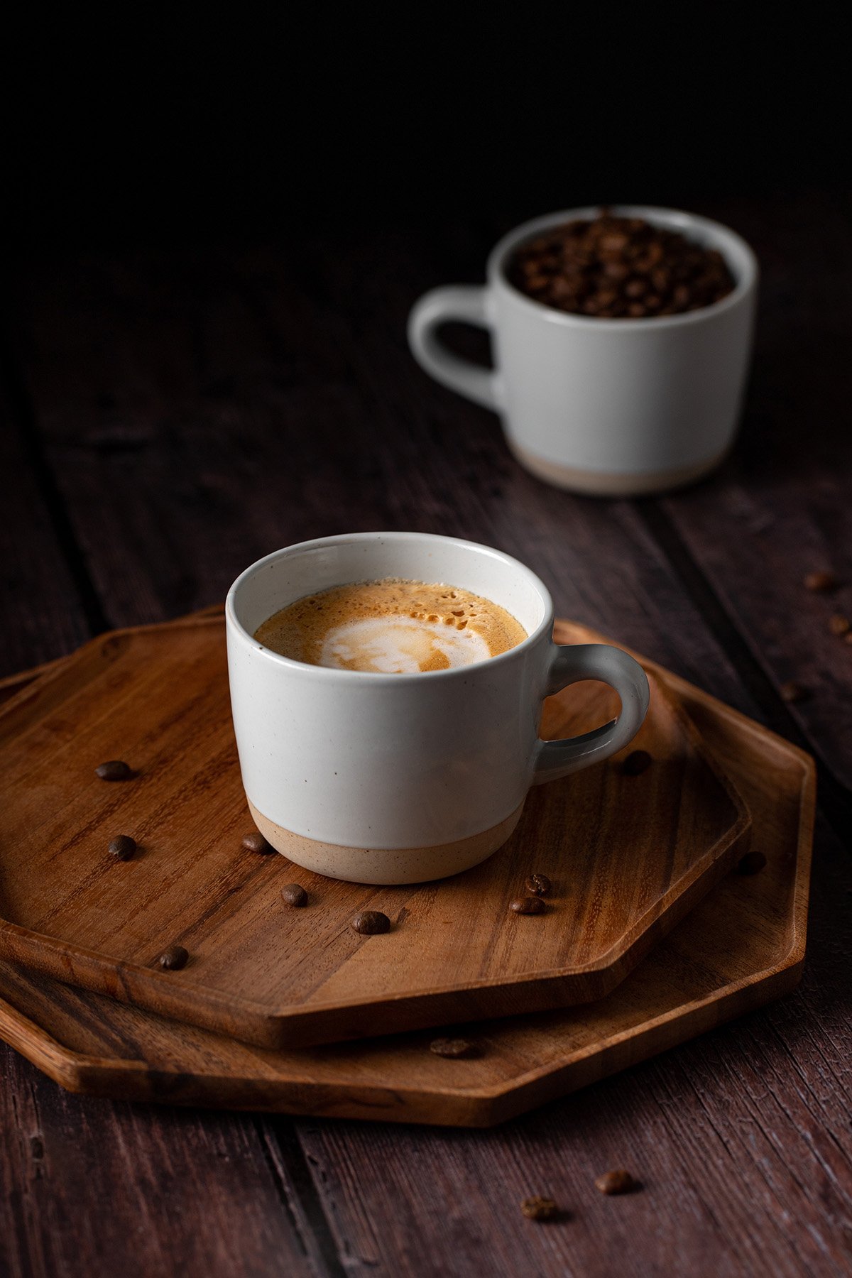 a mug full of blonde vanilla latte on a wooden tray