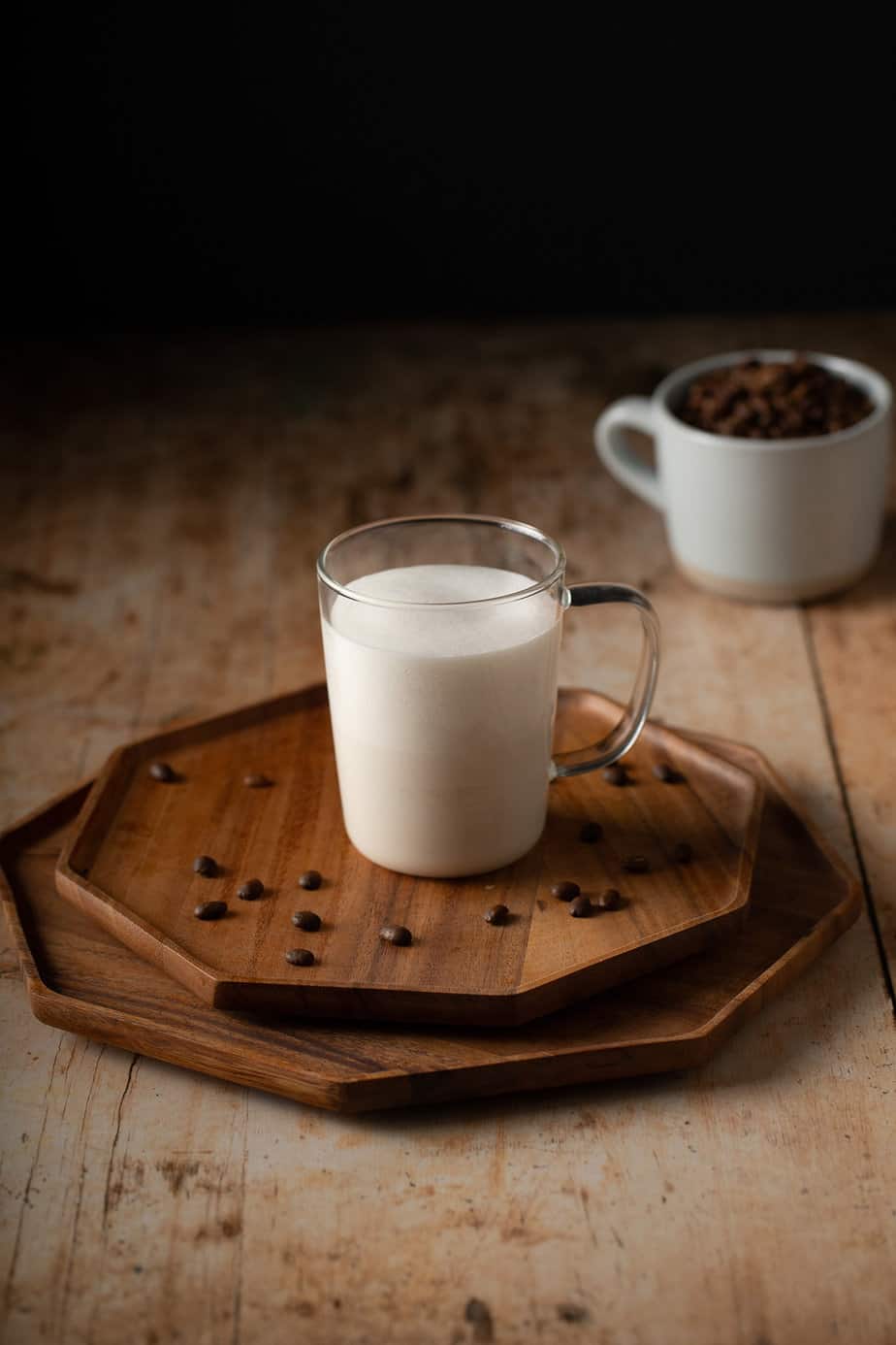 frothed milk in a glass mug