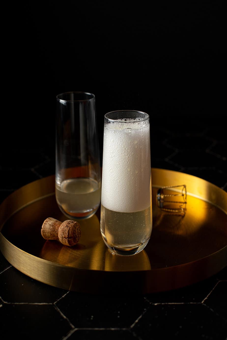 a champagne flute with champagne bubbles