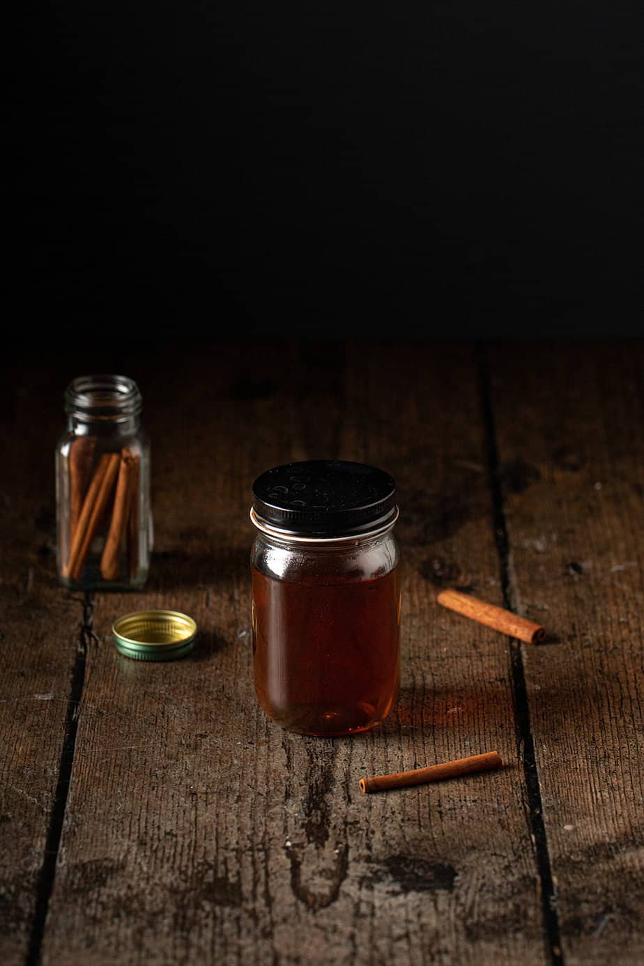small glass jar full of cinnamon dolce syrup