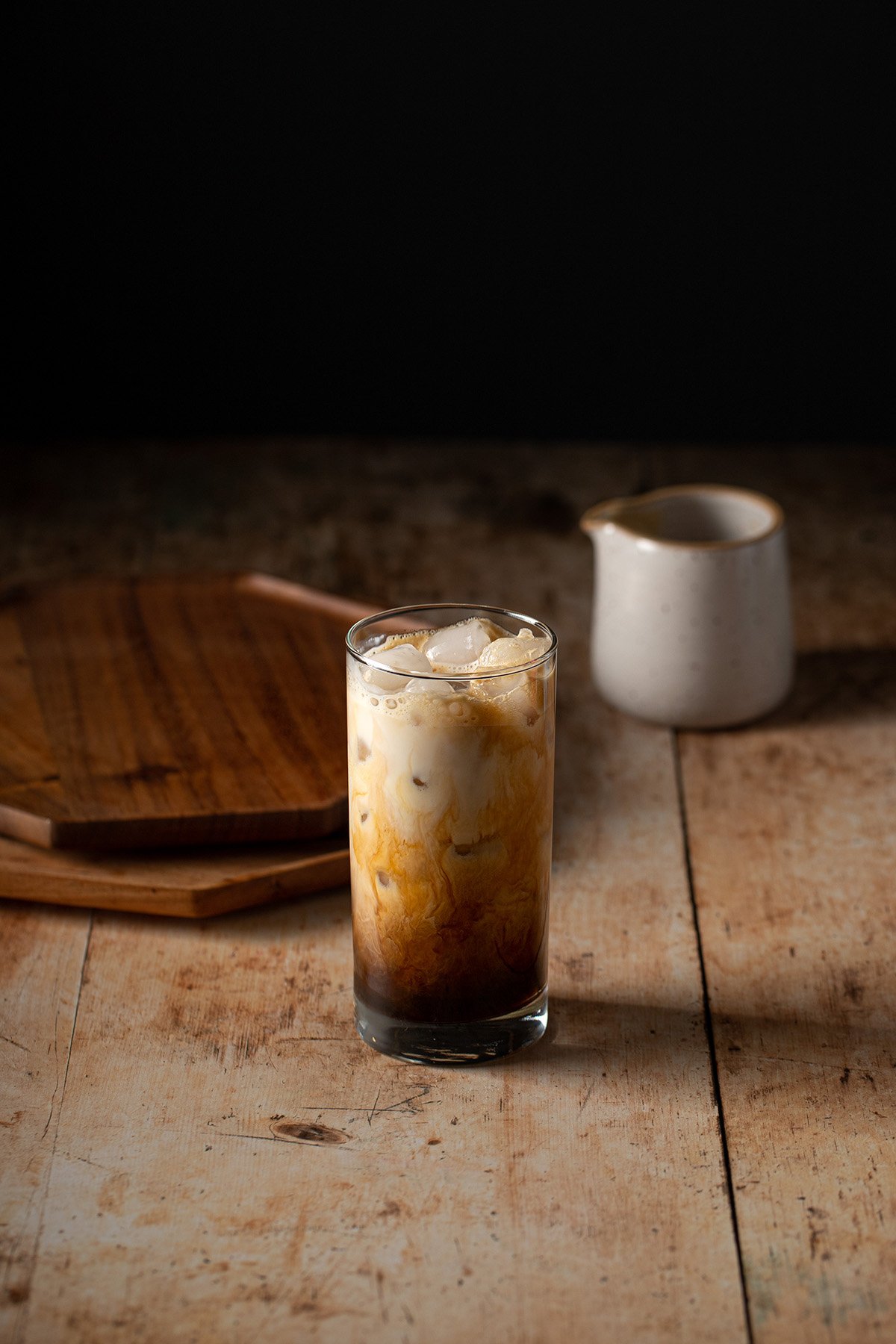 tall glass with ice, espresso, cinnamon dolce syrup, and oat milk