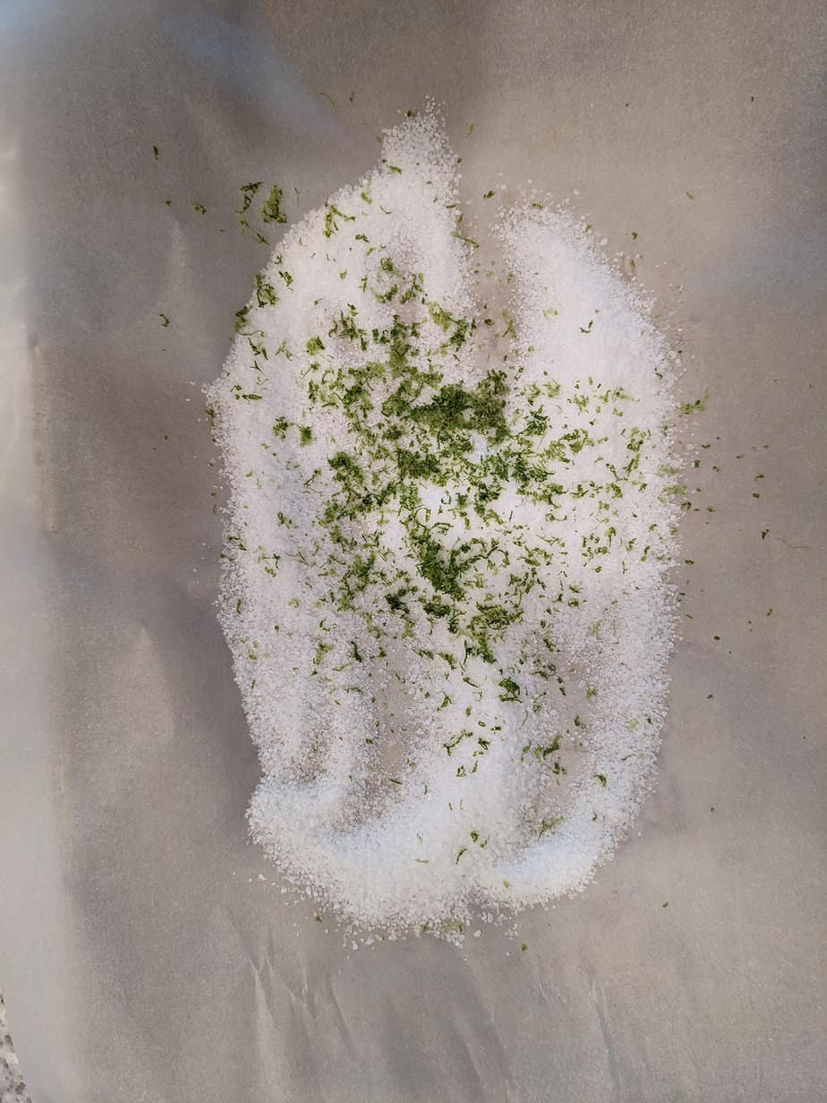 kosher salt and lime zest on a parchment paper lined baking sheet