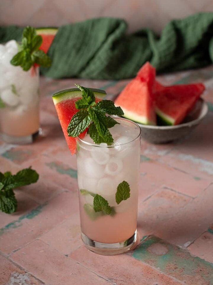 two watermelon mojitos in tall glasses