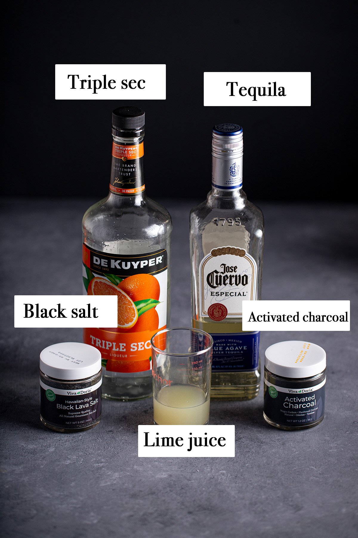 ingredients for making a black magic margarita.