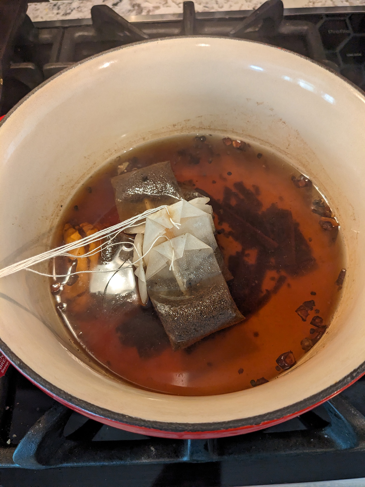 spices and tea bags simmering in water.