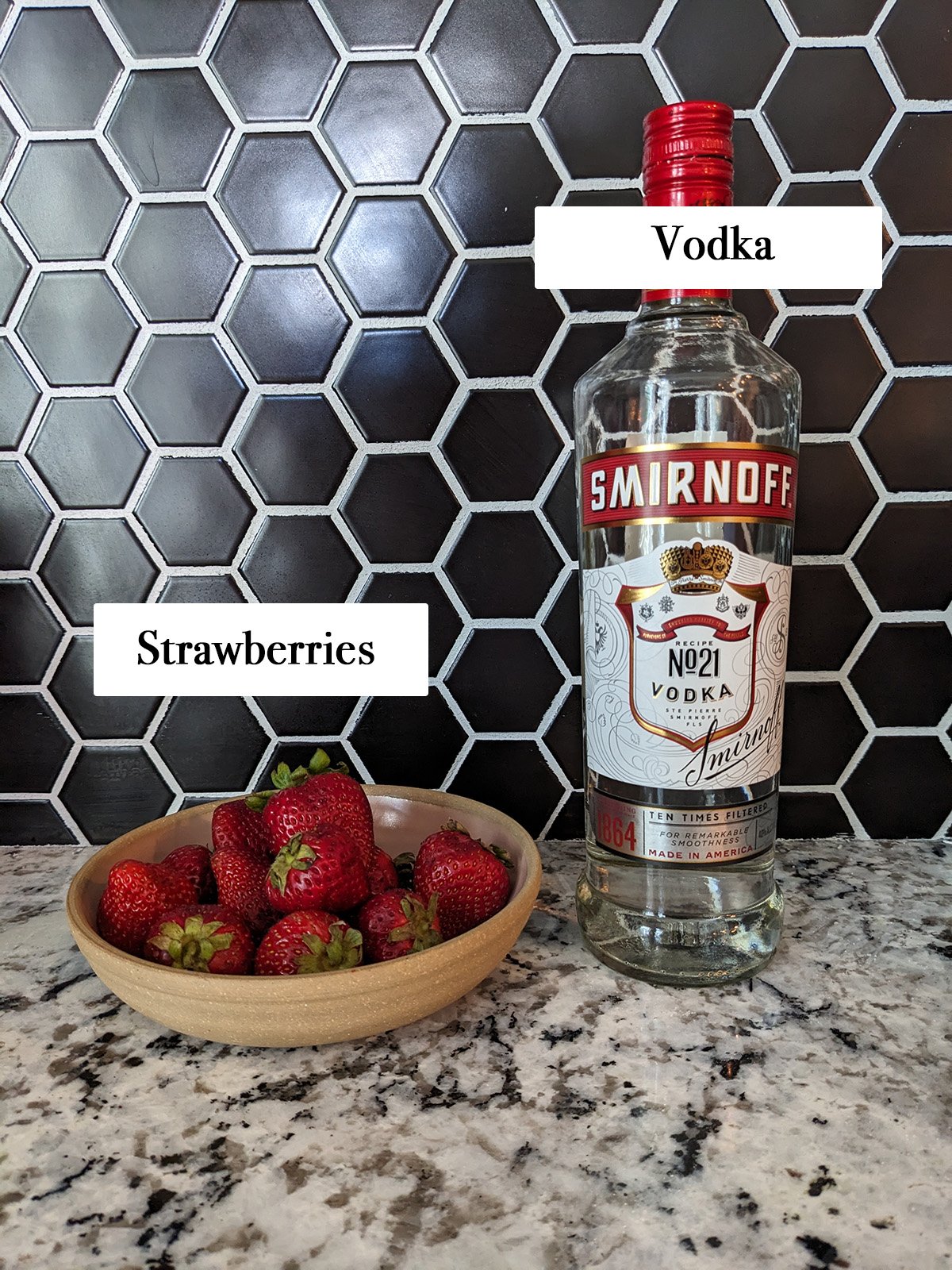 ingredients for making strawberry vodka.
