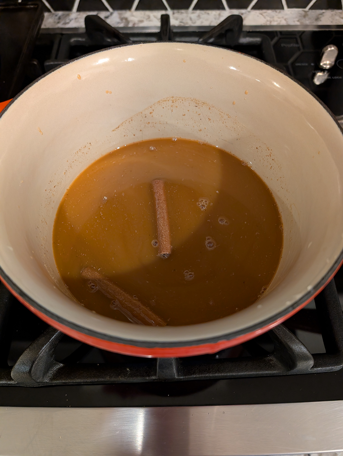 carrot juice, brown and white sugars, and spices whisked together in a saucepan.