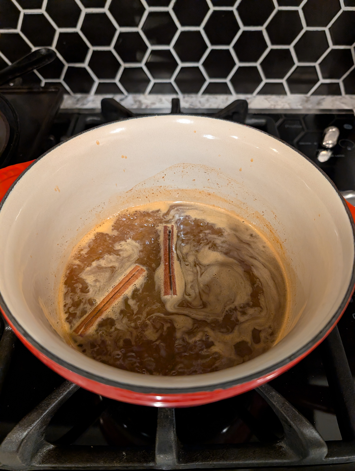 carrot cake syrup simmering in a saucepan.