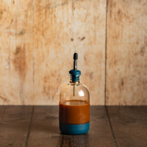 a small bottle containing carrot cake syrup.